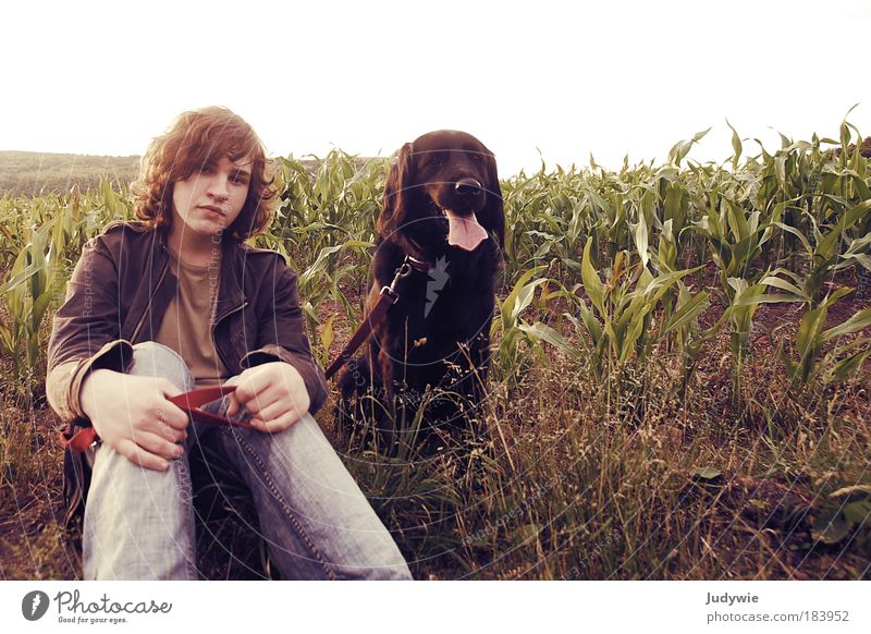 Brother with dog Colour photo Subdued colour Exterior shot Copy Space right Copy Space top Day Evening Twilight Wide angle Portrait photograph Animal portrait