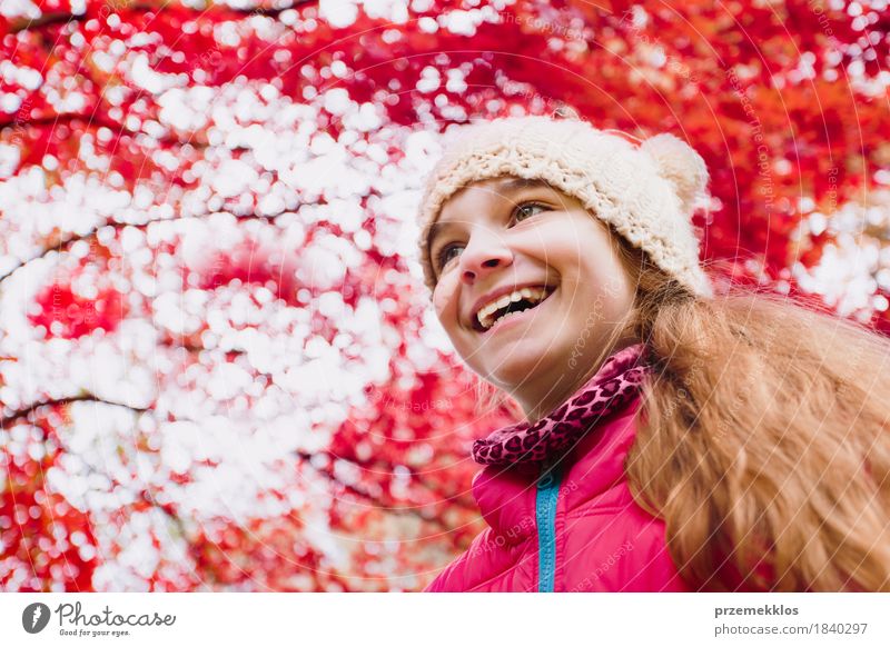 Low angle shot of happy girl under red blurred autumn tree Happy Beautiful Garden Girl Nature Autumn Tree Leaf Park Hat Hair Smiling Happiness Bright Red Colour