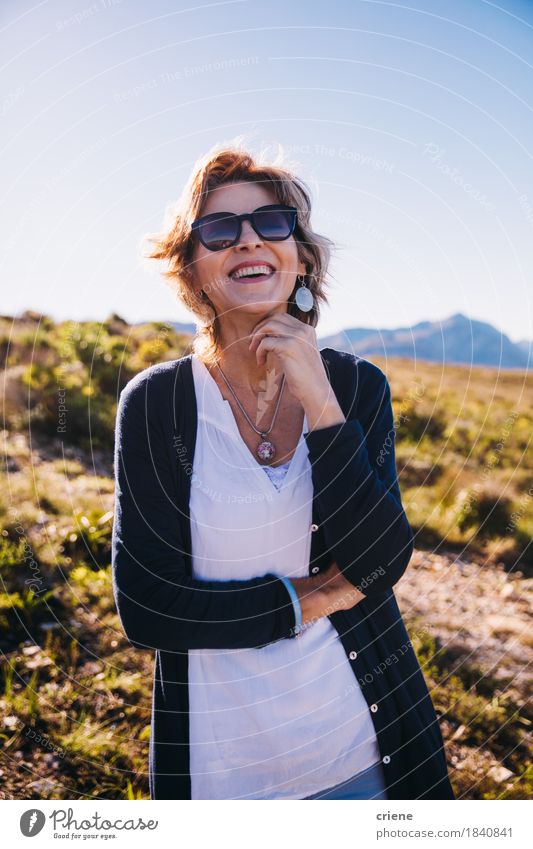 Female mature adult with sunglasses enjoying life smiling - a Royalty Free  Stock Photo from Photocase