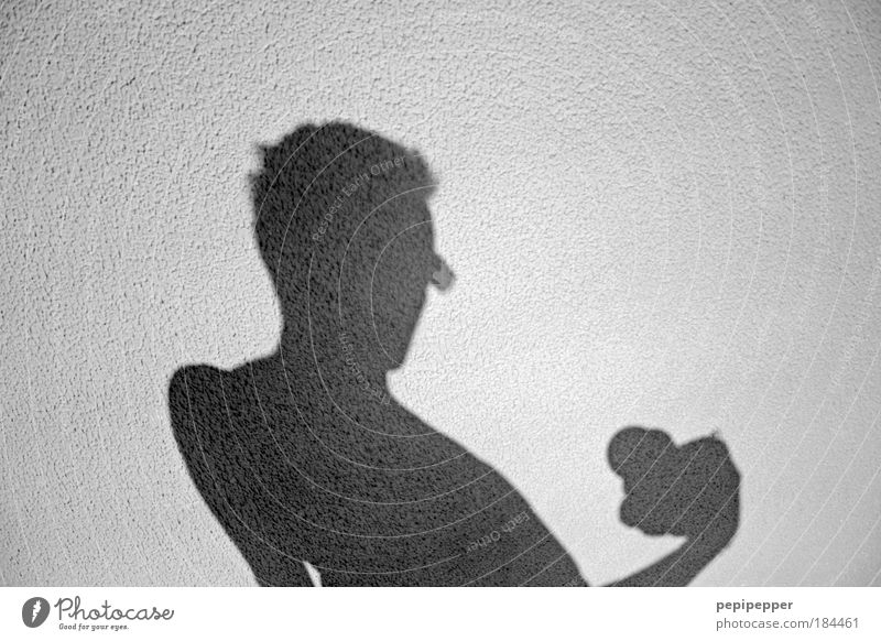 sunlight-shadow I Black & white photo Exterior shot Neutral Background Shadow Contrast Silhouette Sunlight Central perspective Portrait photograph Upper body