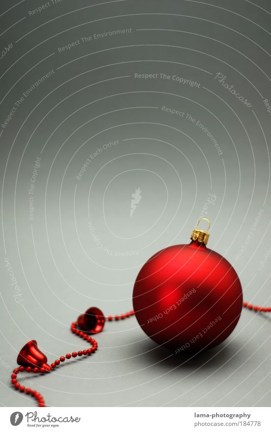 Red Christmas tree ball with bells Colour photo Studio shot Close-up Detail Copy Space top Copy Space middle Neutral Background Reflection