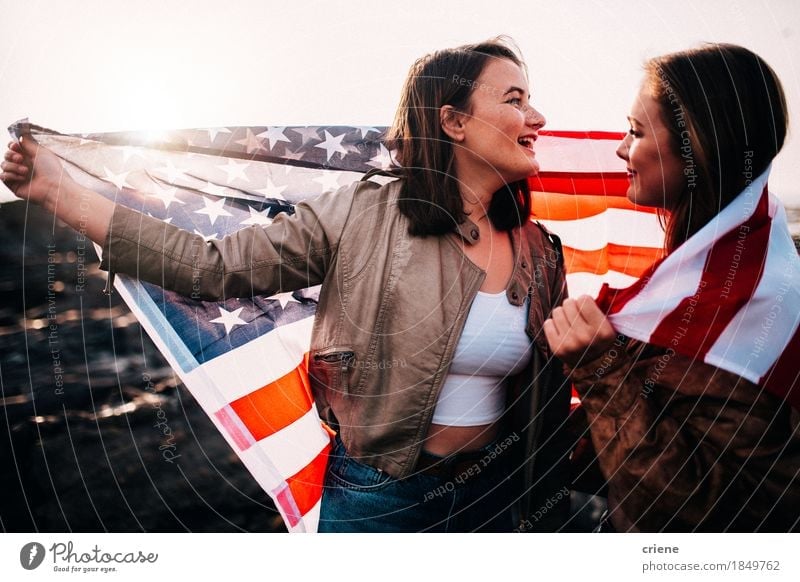 Young teenager girls having fun with USA flag at the beach Lifestyle Joy Vacation & Travel Tourism Trip Freedom Beach Young woman Youth (Young adults) Sister