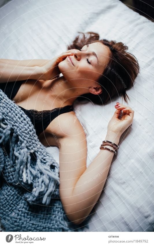 Young smiling women laying in comfortable bed Lifestyle Joy Body Face Relaxation Living or residing Flat (apartment) Furniture Bed Bedroom Young woman