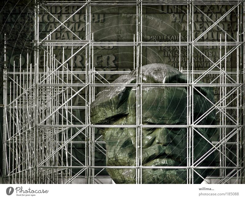 Thoughts are free. Karl Marx Monument scaffolded. Charles Marx monument Scaffolding penned Freedom of expression thoughts are free interdiction tear off