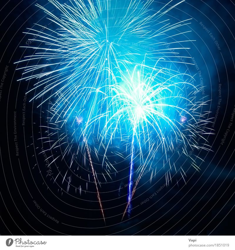 Blue fireworks on the black sky Design Joy Freedom Decoration Night life Entertainment Party Event Feasts & Celebrations Christmas & Advent New Year's Eve Art