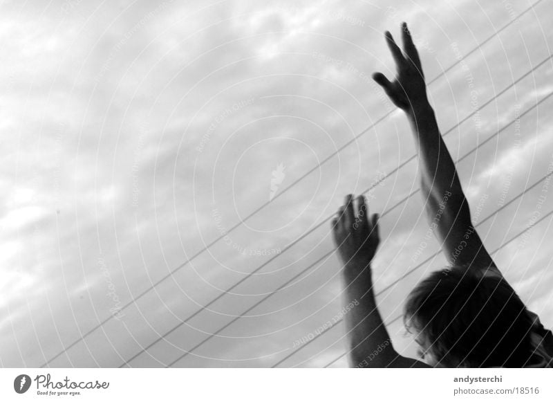 I Can Reach The Sky Fingers Playing Jump Bad weather Clouds Man Arm Traffic infrastructure Catch hands Head Black & white photo grab Evening