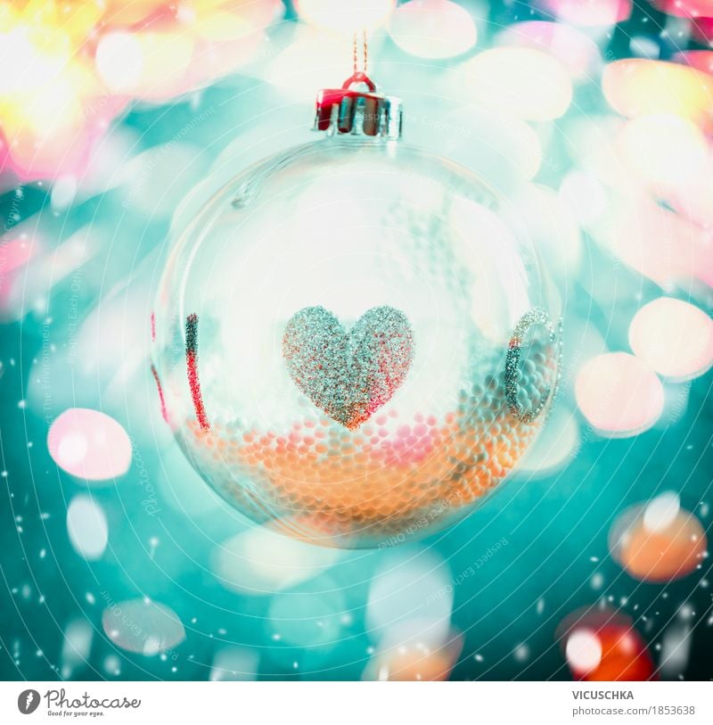 Glass Christmas ball with heart on bokeh background Style Design Joy Winter Decoration Feasts & Celebrations Christmas & Advent Ornament Sphere Yellow