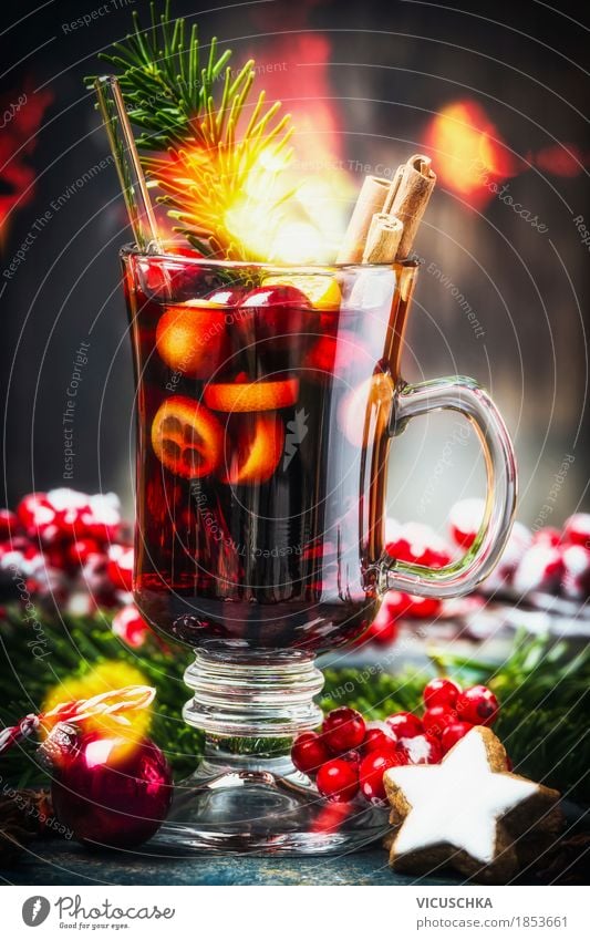Glass of traditional mulled wine with Christmas decoration Fruit Herbs and spices Beverage Hot drink Mulled wine Cup Style Design Joy Winter Table