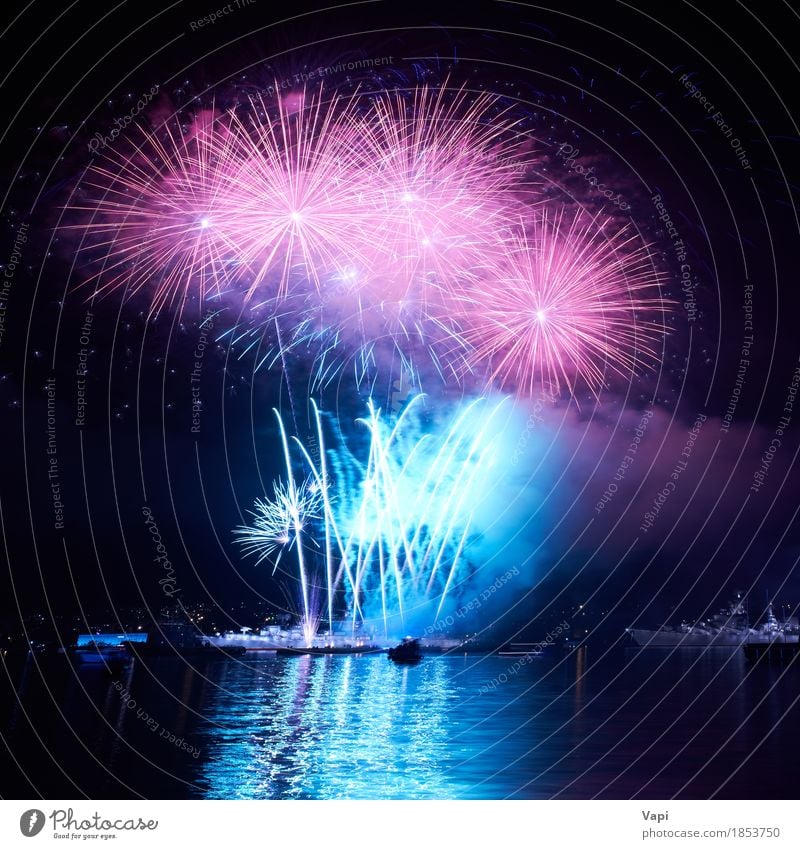 Blue colorful fireworks on the black sky Joy Freedom Night life Entertainment Party Event Feasts & Celebrations Christmas & Advent New Year's Eve Art Shows