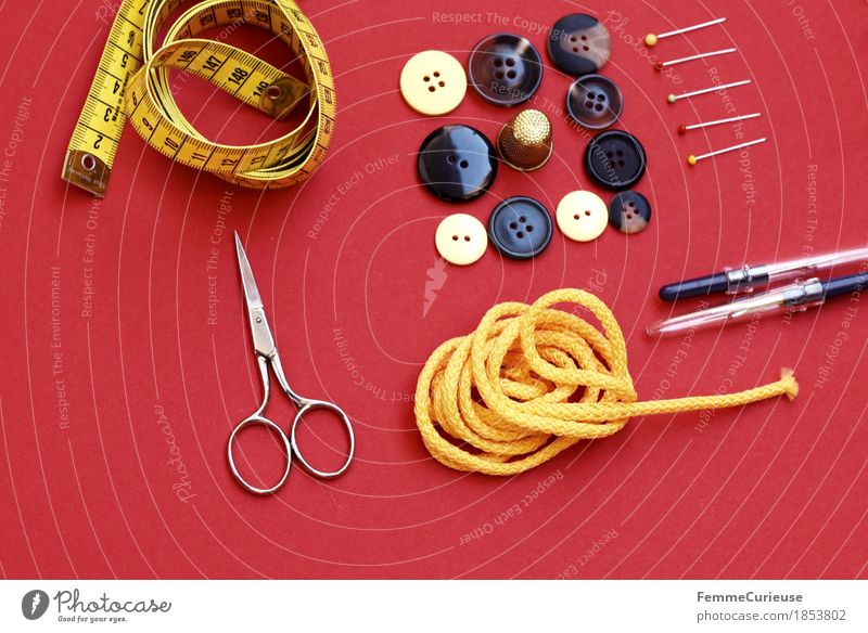 Sewing_1853802 Fashion Creativity Tailoring Make Tape measure Scissors Sewing needle String Yellow Buttons Brown Pin Still Life Red Neutral Background Measure