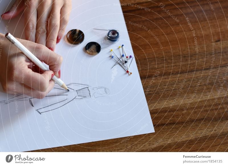 Fashion design_1854135 Creativity Planning Create Draw Conceptual design fashion design Design Designer Pencil Drawing Paper Wooden table Hand Pin Buttons Make