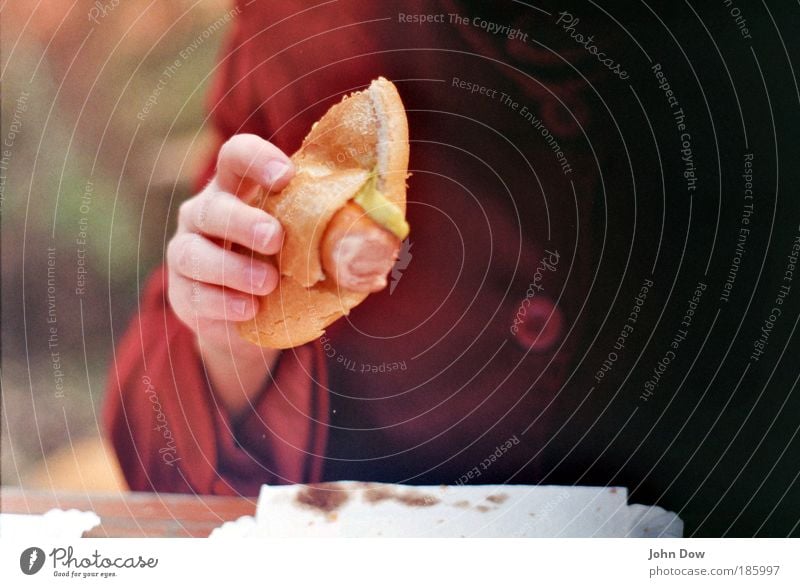 Bockwurst (100) Sausage Nutrition Eating Lunch Fast food Finger food Hand Fingers Human being Jacket Coat Buttons To hold on Delicious Appetite Roll Blur