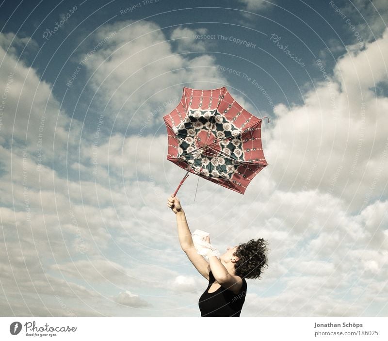 young woman with red umbrella stretches her arms in the blue sky for joy Lifestyle Joy luck Contentment Success Human being Feminine Young woman