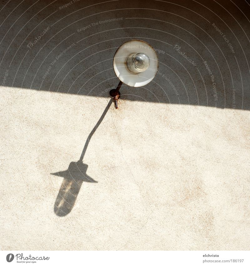 Somebody turn on the lights. Building Wall (barrier) Wall (building) Facade Rust Old Lamp Lampshade White Electric bulb Colour photo Exterior shot Deserted Day