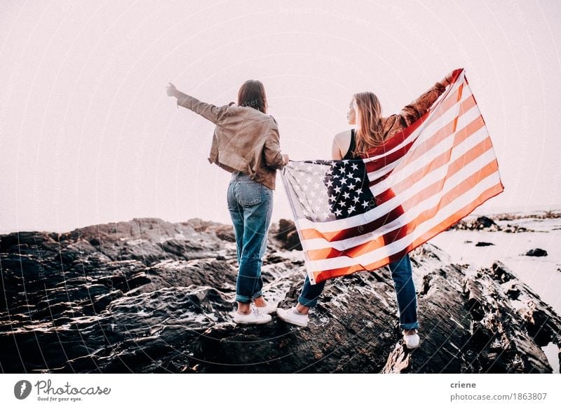 Teenage Girls cheering with USA flag Lifestyle Joy Vacation & Travel Tourism Trip Adventure Freedom Summer Beach Ocean Waves Feasts & Celebrations Young woman