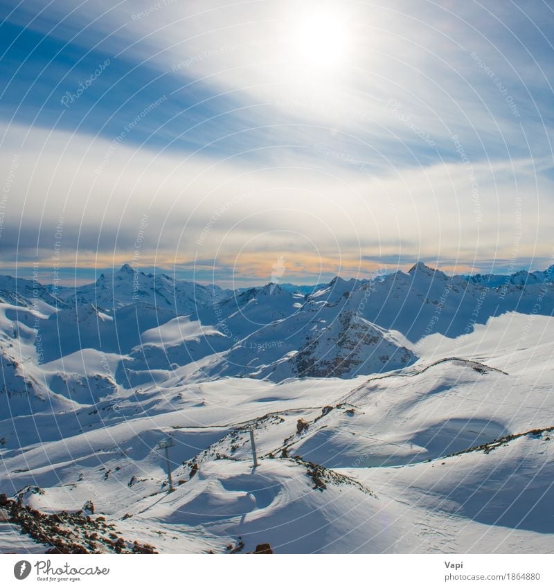 Snowy blue mountains in clouds at sunset Vacation & Travel Tourism Adventure Sun Winter Winter vacation Mountain Climbing Mountaineering Skis Snowboard Nature