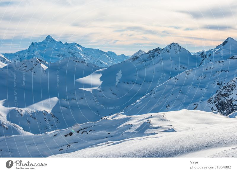 Snowy blue mountains in clouds at sunset Vacation & Travel Tourism Adventure Winter Winter vacation Mountain Climbing Mountaineering Skis Nature Landscape Sky