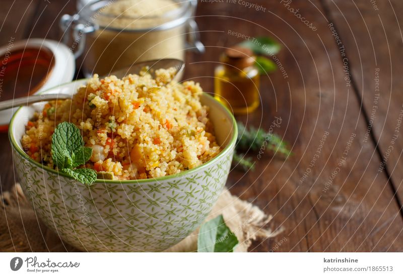 Couscous with shrimps and vegetables in a bowl Seafood Vegetable Grain Lunch Dinner Bowl Spoon Brown Yellow Tradition Africa african Algerian Arabia Cooking