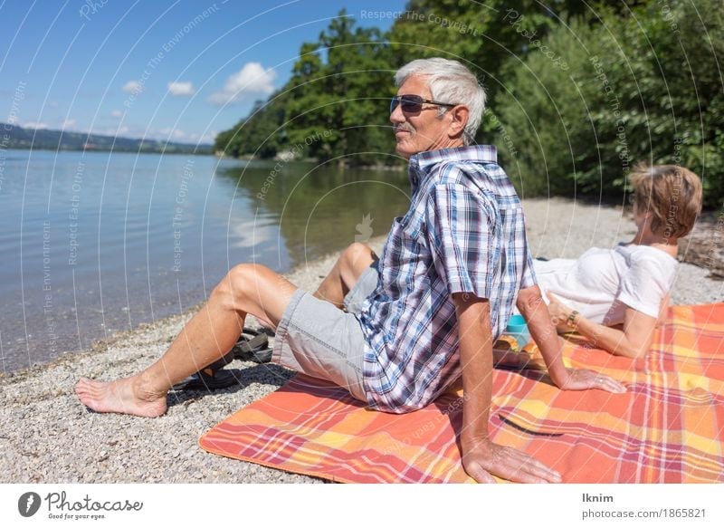 Seniors sit together at Kochelsee Well-being Contentment Relaxation Calm Vacation & Travel Tourism Trip Summer Sun Female senior Woman Male senior Man