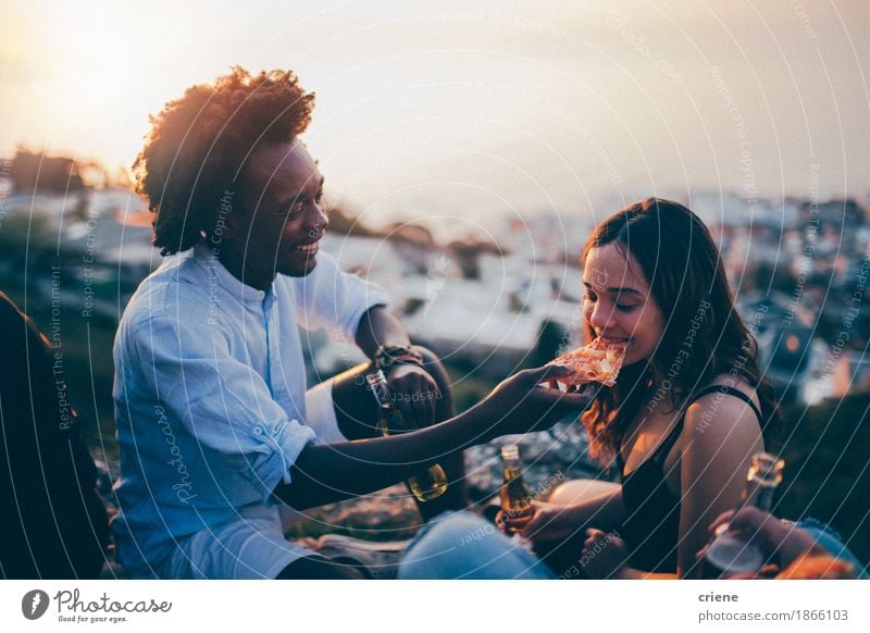 Couple eating pizza at date night in sunset Dough Baked goods Eating Dinner Fast food Italian Food Beverage Drinking Cold drink Alcoholic drinks Beer Bottle