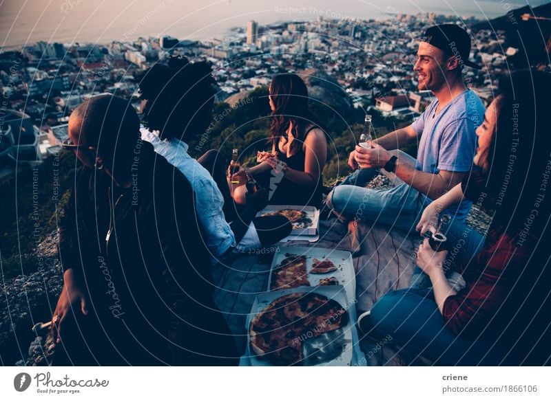 Group of young adult friends having picnic with pizza Food Eating Dinner Picnic Italian Food Beverage Drinking Alcoholic drinks Beer Lifestyle Joy