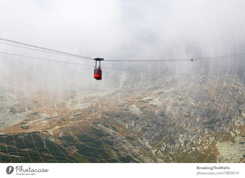 Red mountain cable way car in clouds and fog Leisure and hobbies Vacation & Travel Tourism Trip Adventure Far-off places Freedom Sightseeing Expedition