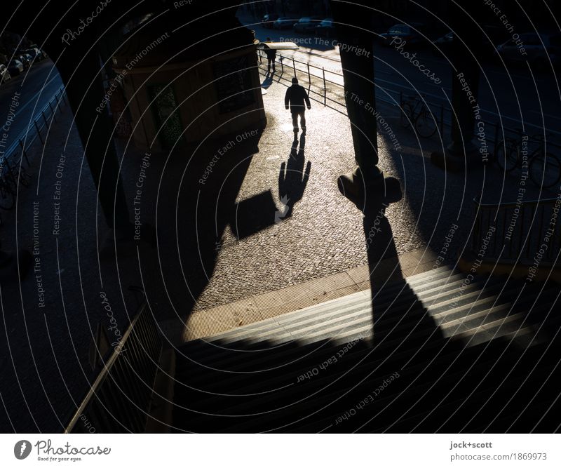 unknown man moves in the light out of the darkness Architecture Stairs Column Pedestrian Lanes & trails Going Exceptional Moody Inspiration Shadow play Abstract