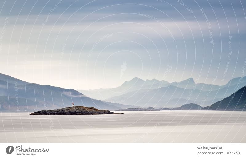 Coast of Norway sea in clouds of haze. Beacon on a rock Lifestyle Beautiful Vacation & Travel Tourism Far-off places Summer Beach Ocean Island Mountain Nature