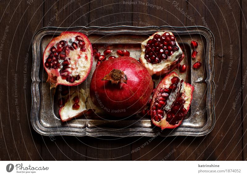 Open fresh ripe pomegranates Fruit Nutrition Vegetarian diet Diet Exotic Wood Metal Fresh Delicious Juicy Brown Red agriculture antioxidant food Garnet healthy