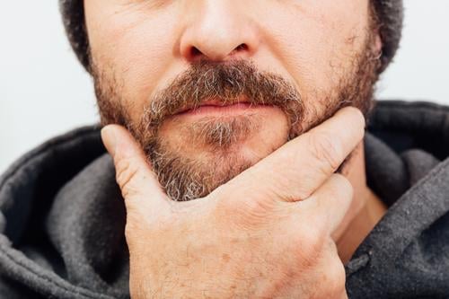 Man with beard, contemplative pose, anonymously trimmed Human being Masculine Adults Hand 1 30 - 45 years Idea Facial hair Meditative think Anonymous Posture