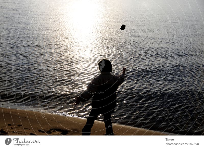 The little man and the sea Child Infancy 1 Human being Elements Sand Water Sunrise Sunset Sunlight Coast River bank Beach Lake Flying Throw Free Uniqueness