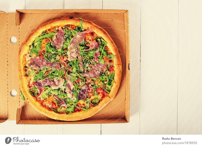 Italian Pizza With Rucola, Prosciutto Ham And Parmesan Cheese Food Meat Vegetable Nutrition Eating Lunch Dinner Fast food Italian Food Table Restaurant Wood