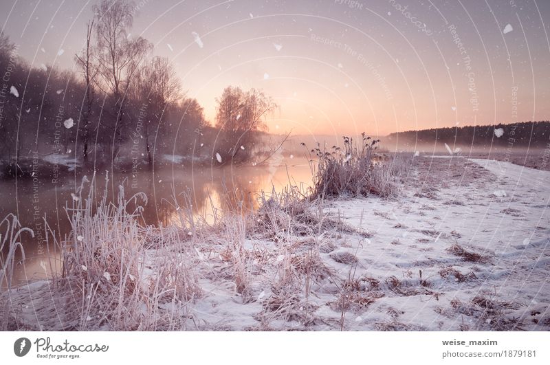 Winter misty dawn on the river. Snowflakes, snowfall Vacation & Travel Tourism Adventure Freedom Nature Landscape Air Water Drops of water Sky Sunrise Sunset