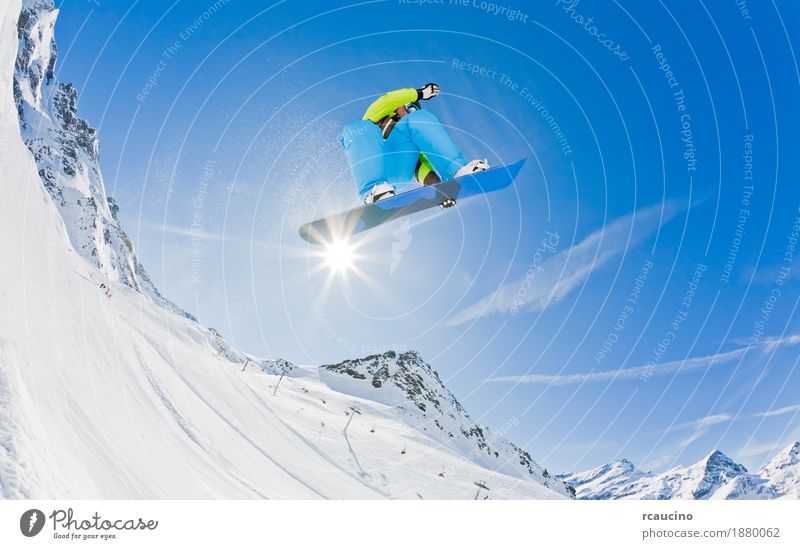 Snowboarder launching off a jump, Italy. Joy Vacation & Travel Winter Mountain Sports Boy (child) Man Adults Alps Jump Cool (slang) Dangerous cold Extreme fast