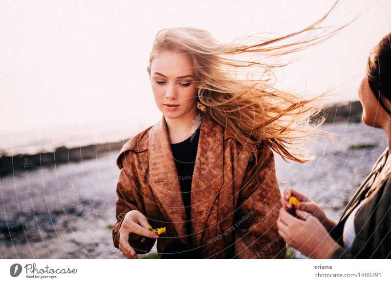Portrait of young women with long blonde hair blowing in wind Lifestyle Style Joy Freedom Summer Sun Beach Young woman Youth (Young adults) Woman Adults