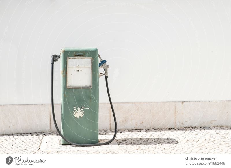 Old gas pump in front of white wall Petrol station Gasoline petrol price Petrol pump Refuel Summer refuel Wall (barrier) Wall (building) Transport Colour photo