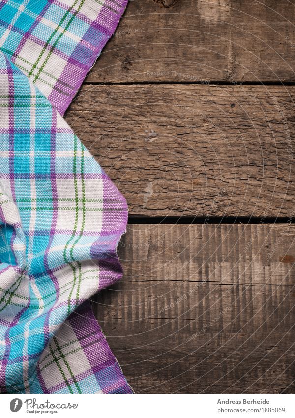 Tablecloth on wooden background - a Royalty Free Stock Photo from Photocase