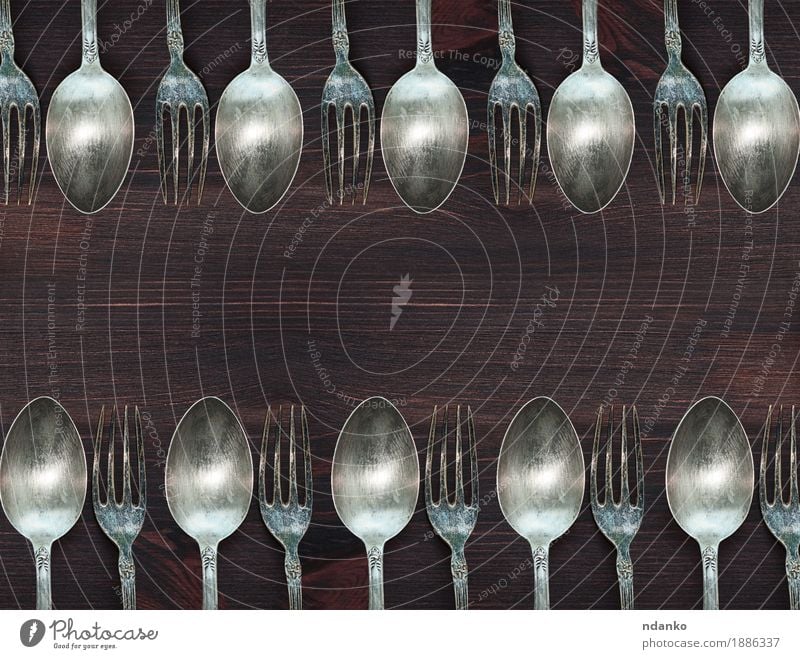 Old Retro cutlery set on vintage wooden background Stock Photo by