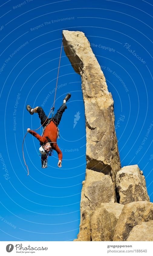 Rock climber falling upside down. Adventure Climbing Mountaineering Man Adults 1 Human being 30 - 45 years Hiking boots Helmet To fall Tall Willpower Trust