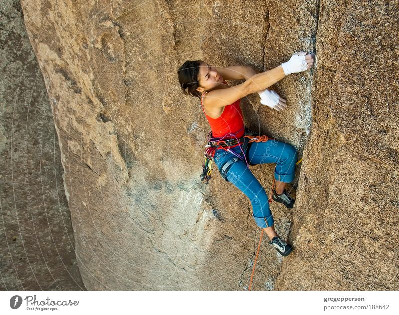 Female rock climber. Adventure Expedition Climbing Mountaineering Rope Young woman Youth (Young adults) 1 Human being 18 - 30 years Adults Athletic Tall Success