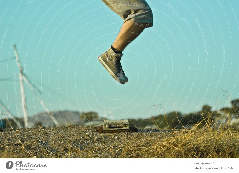 jump and the world is yours... Bottom Legs 1 Human being Radio (device) cassette player Nature Earth Footwear Sneakers Jump Colour photo Exterior shot Evening