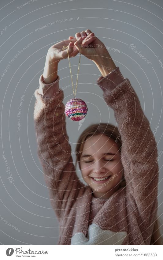 Young girl enjoying her handmade Christmas ball Lifestyle Joy Happy Decoration Feasts & Celebrations Christmas & Advent Human being Girl Youth (Young adults) 1