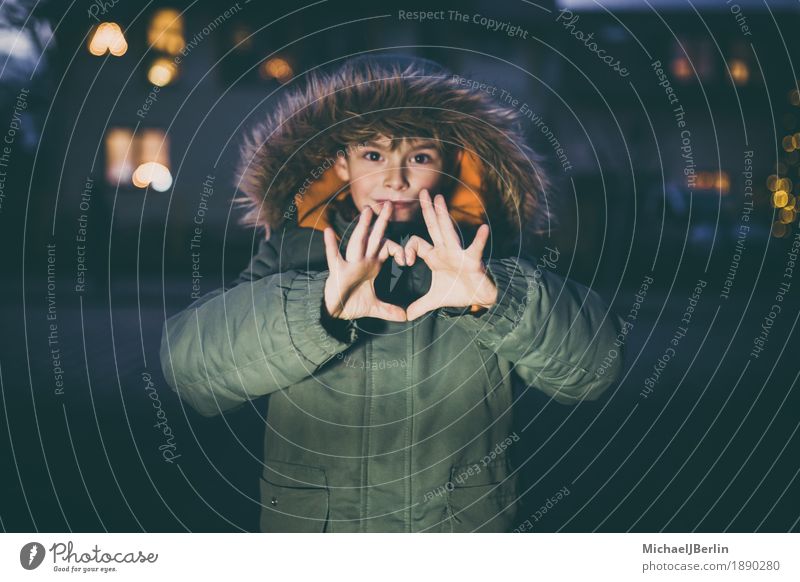 Boy shows heart with hands, in winter clothes in urban environment Winter Child Human being Masculine Infancy Fingers 1 3 - 8 years Love Heart Sign