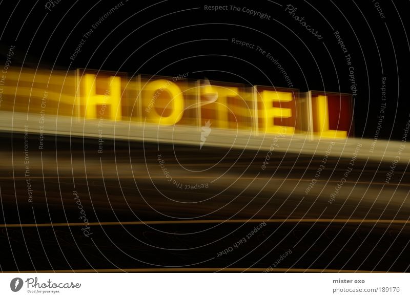 Hotel in motion Elegant Vacation & Travel Trip City trip House (Residential Structure) Facade Roof Trashy Brown Yellow Black Neon sign Colour photo