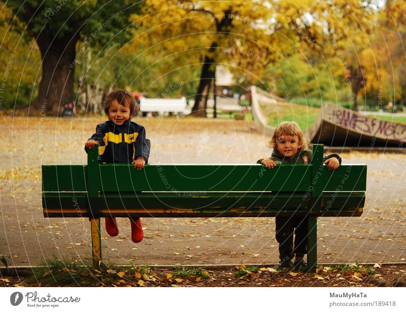 Two children Human being Child Boy (child) Friendship Life 2 3 - 8 years Infancy Plant Autumn Tree Garden Park Playing Brown Yellow Green Red Colour photo Day