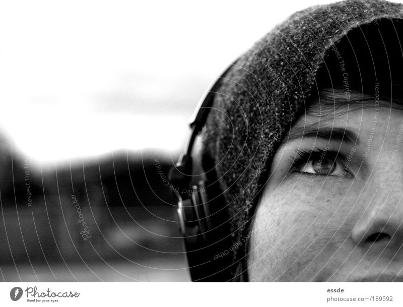 There's music in there. MP3 player Headphones Feminine Young woman Youth (Young adults) Eyes Nose 18 - 30 years Adults Nature Winter Cap Observe Think
