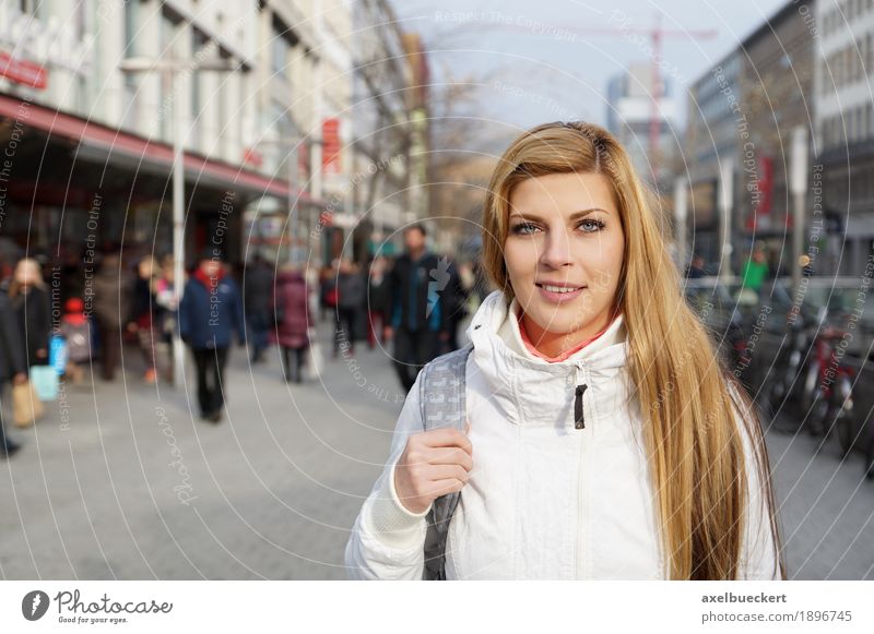 young woman in the city centre Lifestyle Shopping Leisure and hobbies Human being Feminine Young woman Youth (Young adults) Woman Adults 1 Group Crowd of people
