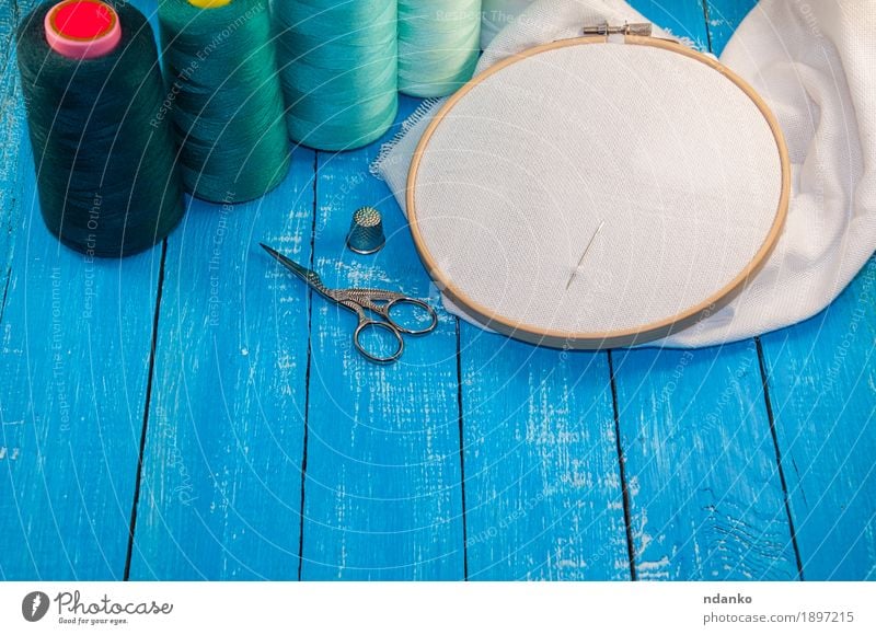 turquoise thread with the fabric in the wooden embroidery frame - a Royalty  Free Stock Photo from Photocase