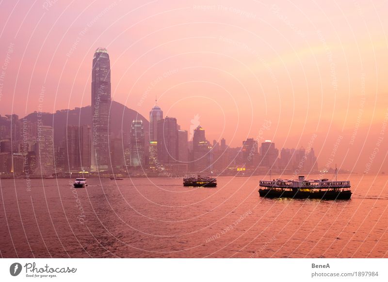 Sunset with boats in front of the Hong Kong skyline Capital city Port City Downtown Skyline Overpopulated High-rise Tourist Attraction Vacation & Travel Town