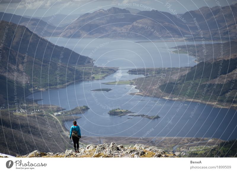 Woman hiking to mountain with view of Loch Leven, Scotland Vacation & Travel Adults Nature Fitness Adventure Discover Experience Leisure and hobbies Horizon